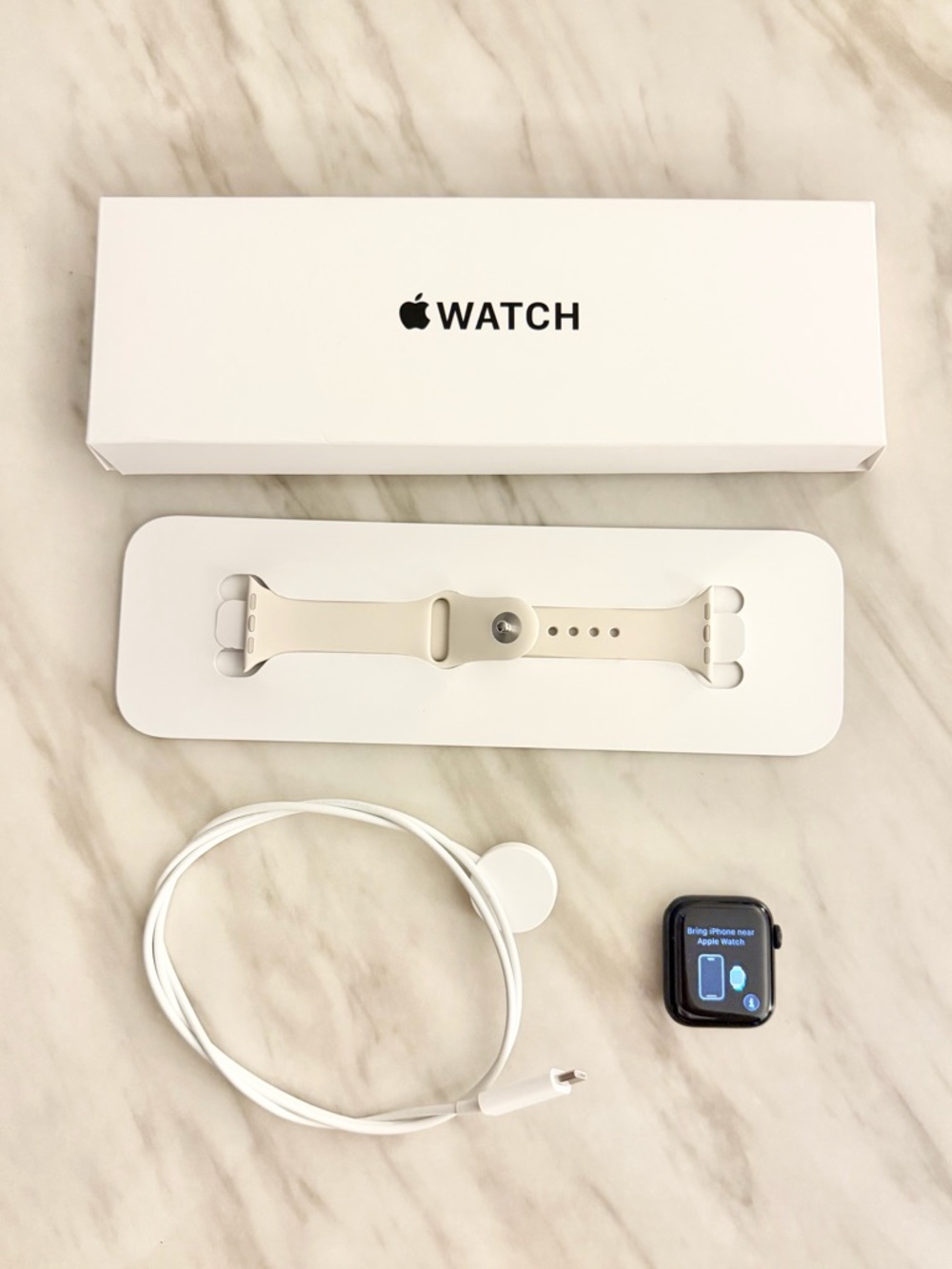 Apple Watch Series SE 1st Gen 40mm with Cream Sport Band and White Charger